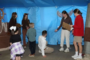 students acting out play